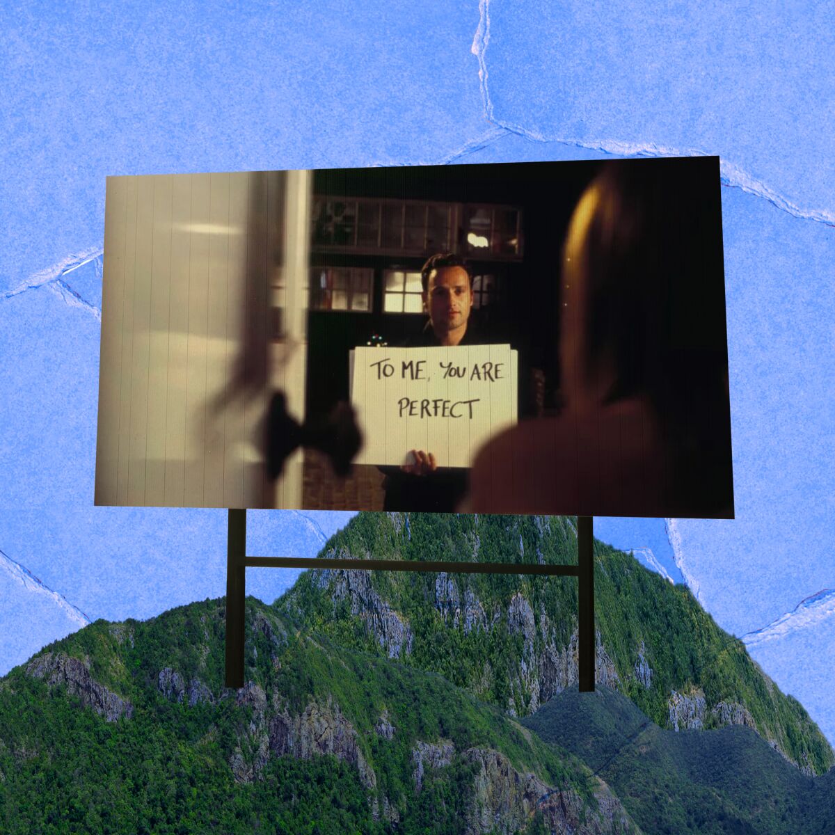 An illustration of a movie screen, with a scene from "Love Actually," on a mountaintop. 