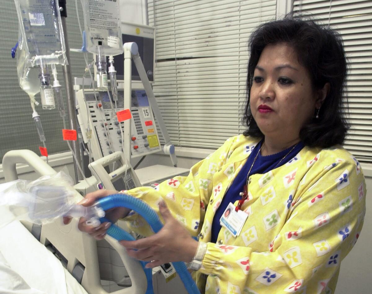 A respiratory therapist at Newark Beth Israel Medical Center in New Jersey sets up a ventilator in the intensive care unit. Hospitals bracing for coronavirus patients may face a critical shortage of equipment.