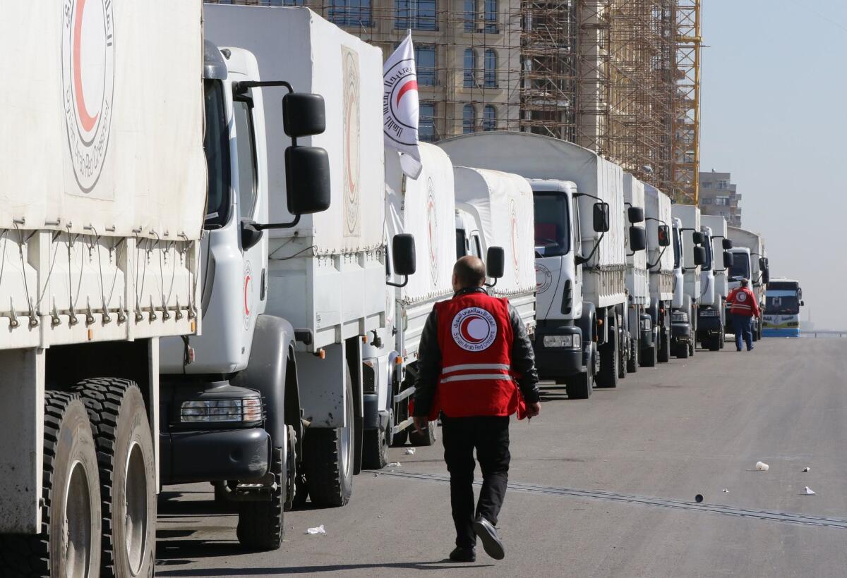 A Red Crescent convoy prepares to leave Damascus for the besieged areas of Madaya and Zabadani.