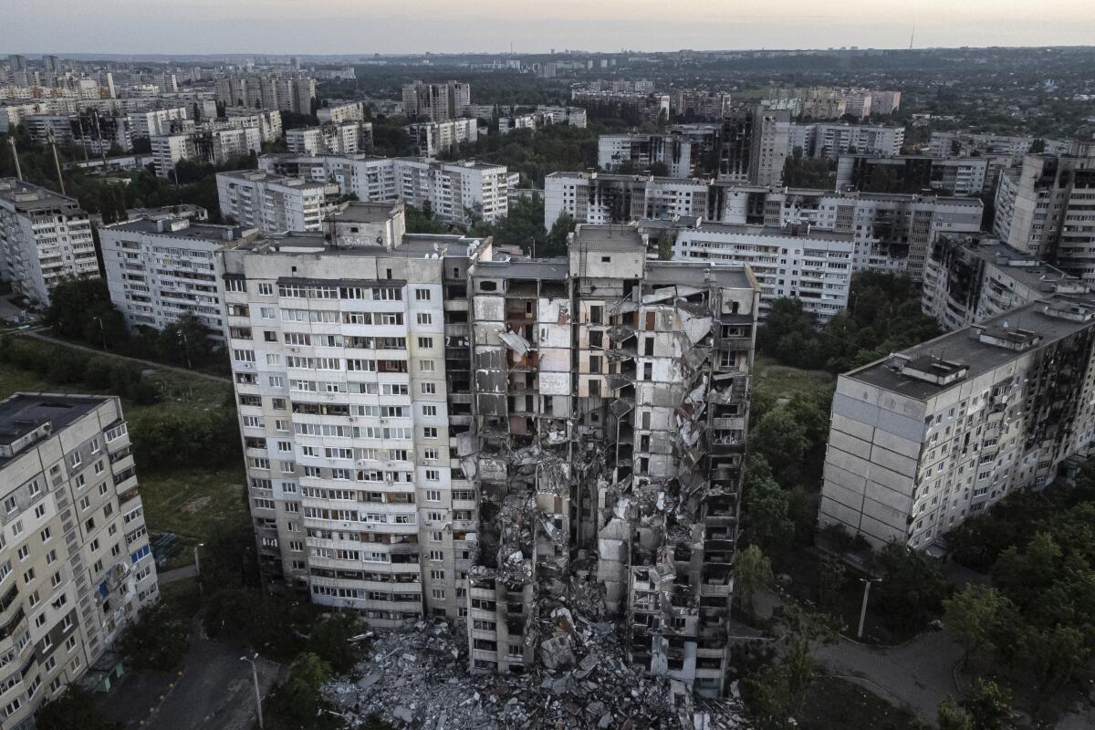 An apartment building damaged by Russian attack is seen in Kharkiv, Ukraine, on Monday, July 4, 2022. The Ukrainian military's General Staff says that Russian forces are trying to press their offensive deeper into eastern Ukraine after capturing a key stronghold. (AP Photo/Evgeniy Maloletka)