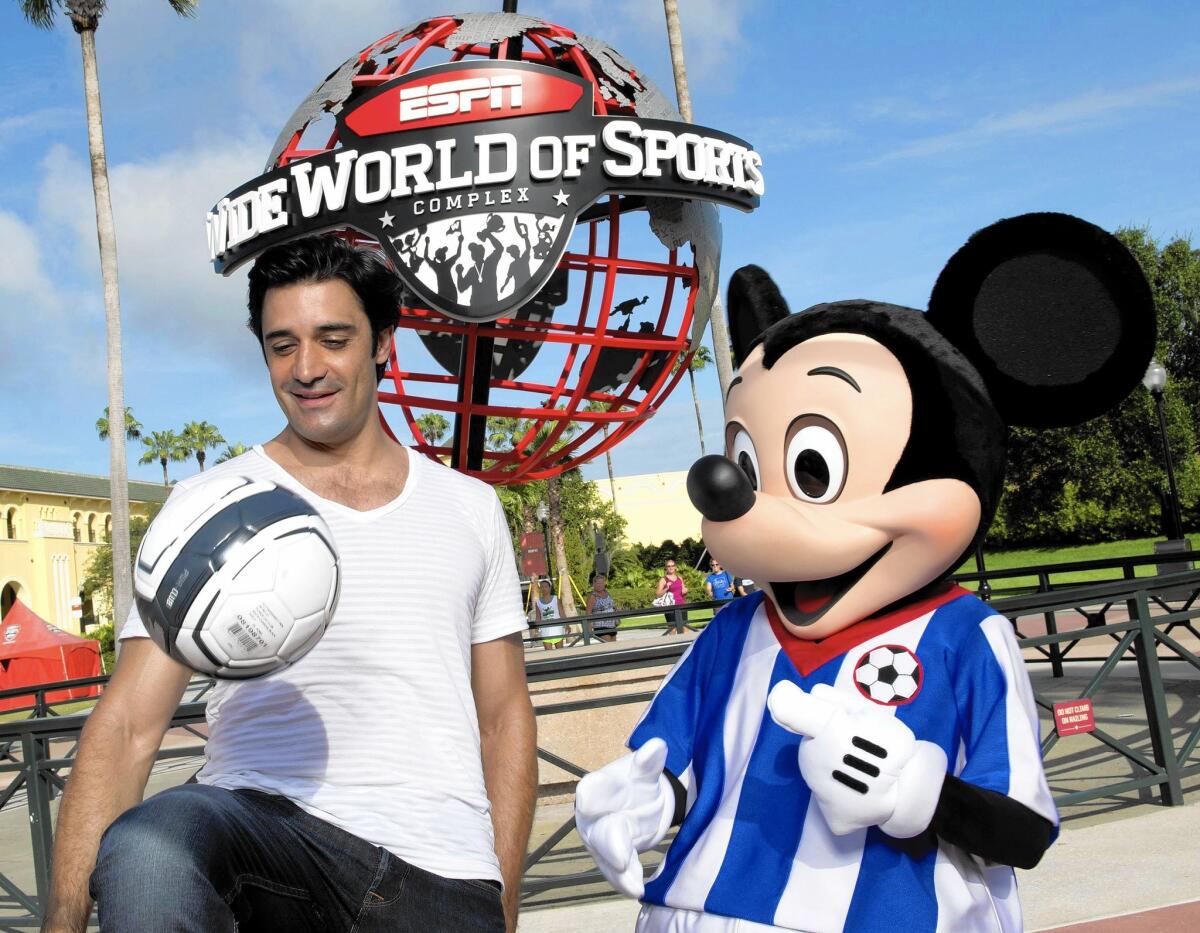 Actor Gilles Marini plays with Mickey Mouse at ESPN Wide World of Sports at Walt Disney World in Florida in 2013.