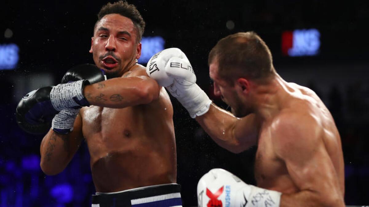 Andre Ward sends Sergey Kovalev reeling with a punch to the head during their light-heavyweight title fight on Saturday night in Las Vegas. For more images from the fight card, click on the photo above.