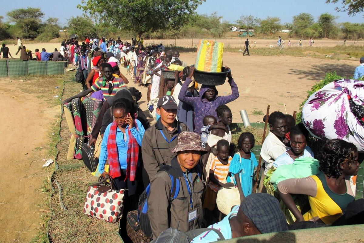 South Sudanese civilians line up outside a U.N. compound in Bor offering refuge and basic health necessities.