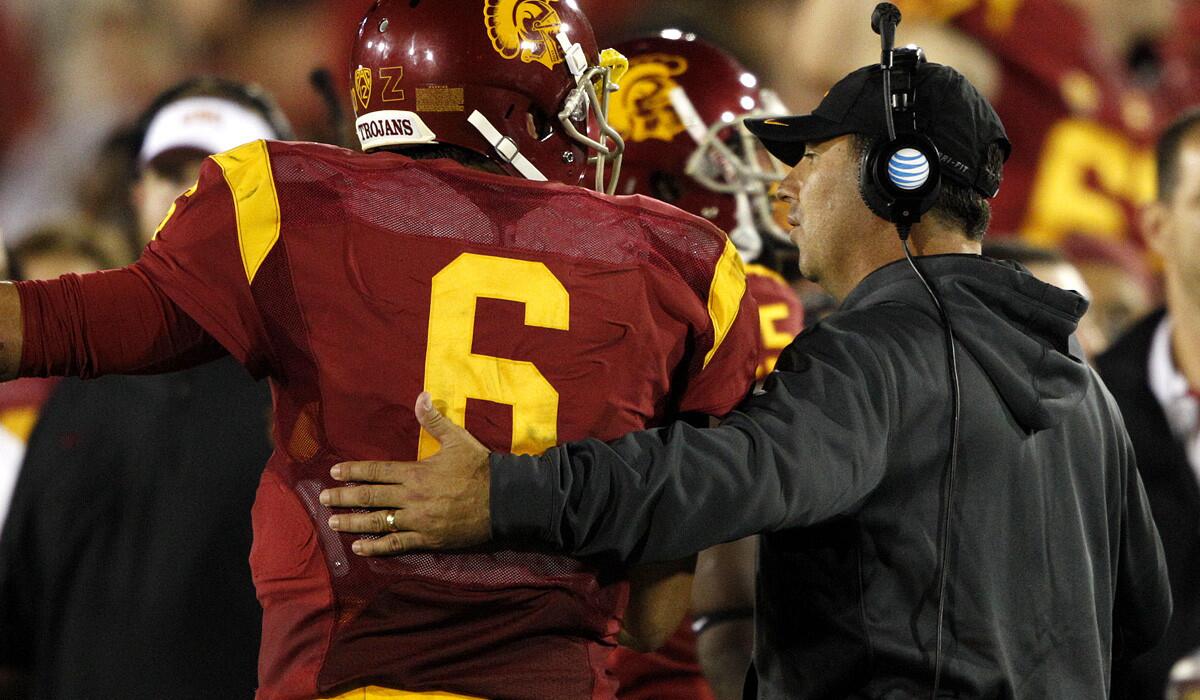USC Coach Steve Sarkisian talks to quarterback Cody Kessler (6) after the Trojans scored against Oregon State in the fourth quarter of a 35-10 victory.