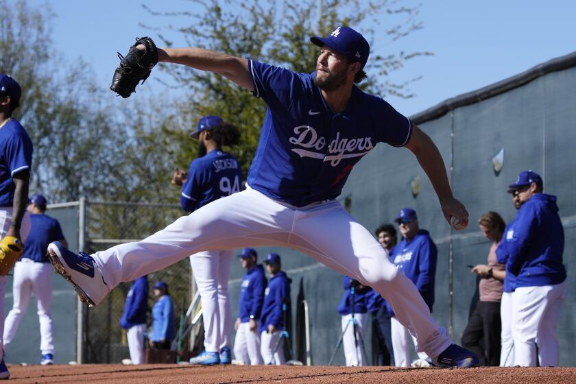 Los Angeles Dodgers starting pitcher Clayton Kershaw pitches during the first day of spring training.