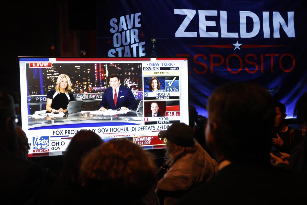 Supporters of Republican gubernatorial candidate Lee Zeldin watch