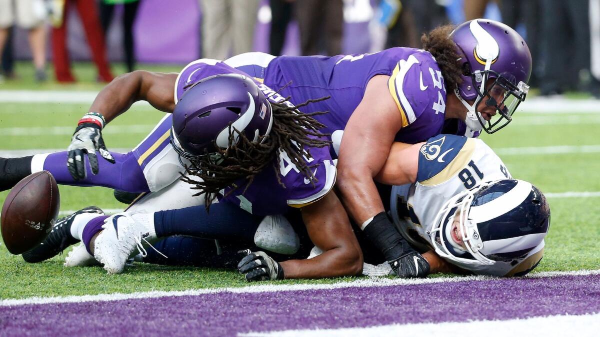 Minnesota Vikings strong safety Anthony Harris recovers a fumble by Los Angeles Rams wide receiver Cooper Kupp on Sunday.
