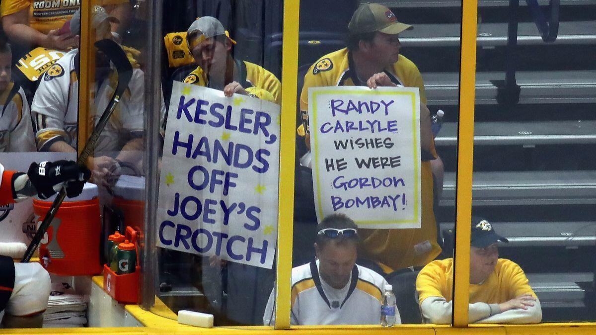Nashville Predators fans hold signs during the first period in Game 3 of the Western Conference Final between the Ducks and Predators during the 2017 Stanley Cup playoffs, Tuesday.