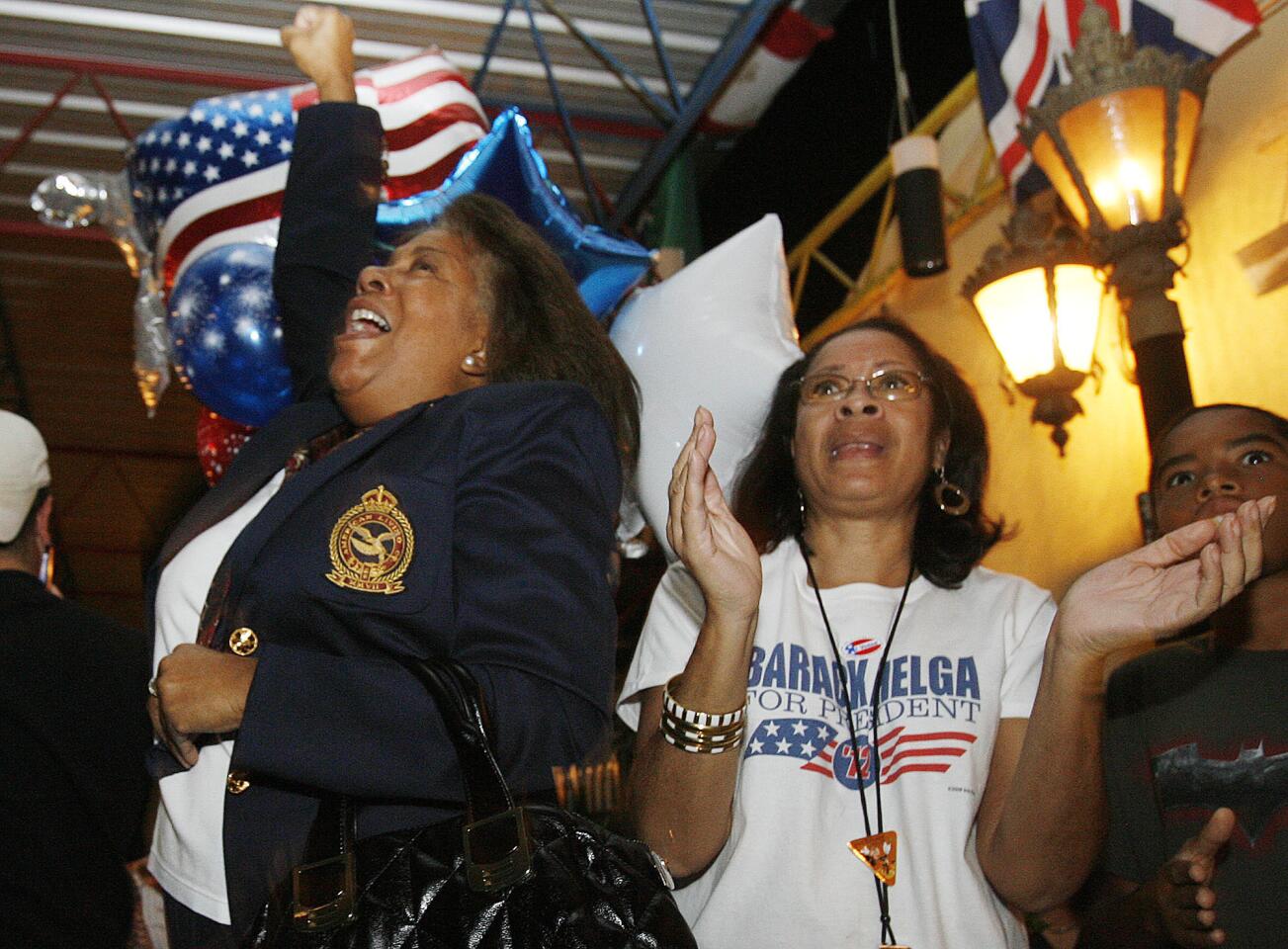 Pamela Wilson, of Tuluca Lake, and Helga Kuhn, of South Pasadena, celebrate the announcement of President Barack Obama being re-elected to his second term as President of the United States at a Democrat Party celebration at Burger Continental in Pasadena on Tuesday, November 6, 2012.