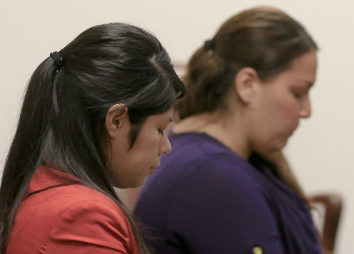 Vanesa Tapia Zavala, left, and Candace Marie Brito, shown at a preliminary hearing earlier this month, are charged with murder and with assault likely to cause great bodily injury in the beating death last month of Kim Pham outside a Santa Ana nightclub.