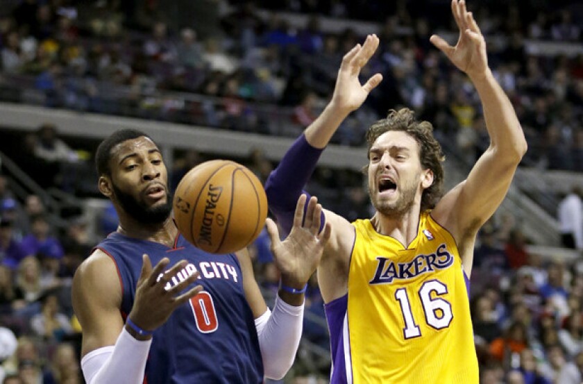 Lakers forward Pau Gasol (16) is fouled by Detroit's Andre Drummond Friday night in Detroit.