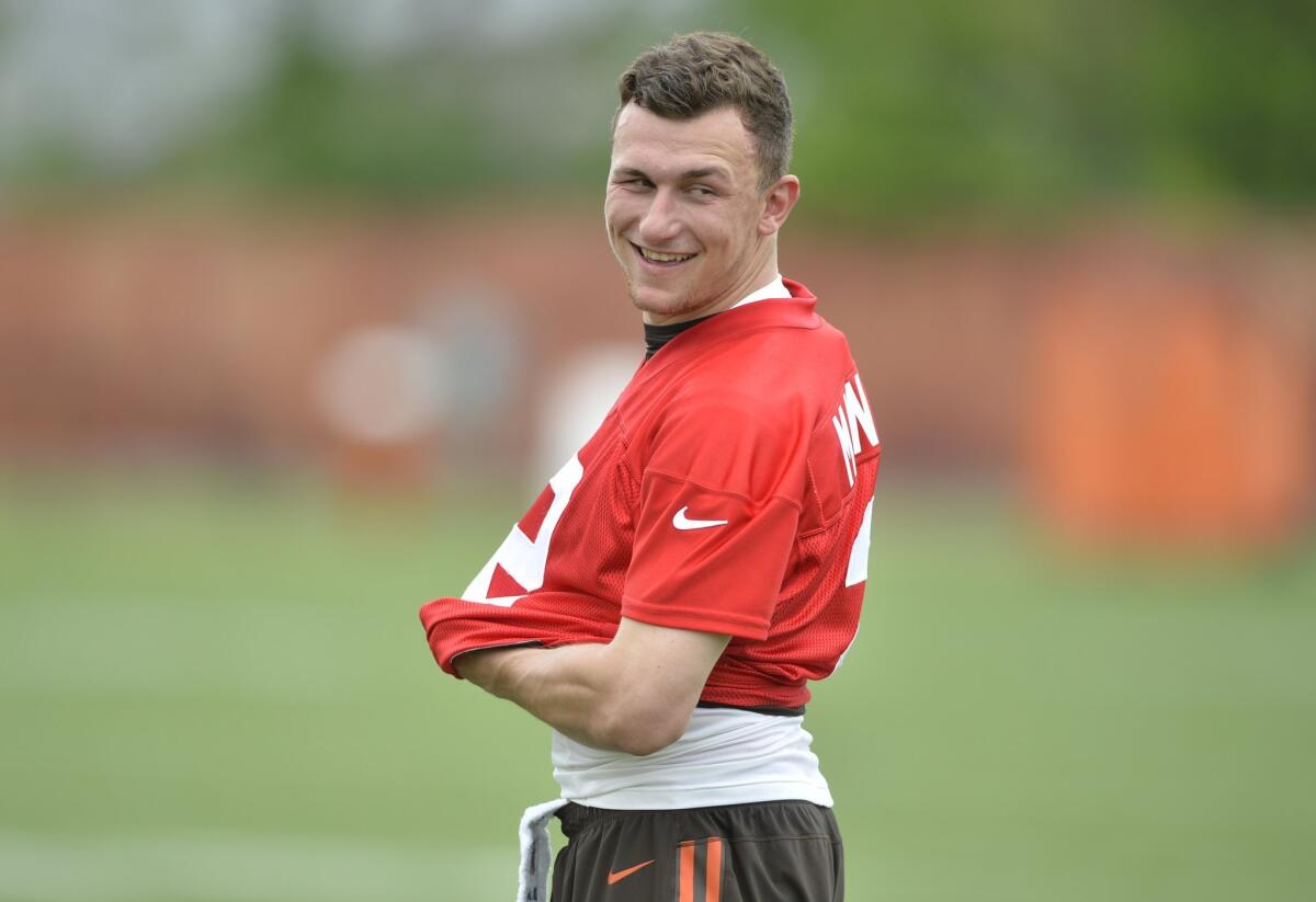 Cleveland Browns quarterback Johnny Manziel smiles during an OTA on Tuesday.