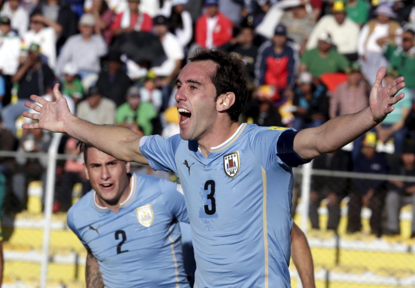 Diego Godin of Uruguay celebrates with teammates after scoring against Bolivia during their 2018 World Cup qualifying soccer match in La Paz