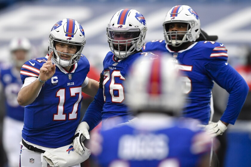 Buffalo Bills quarterback Josh Allen (17) reacts after throwing a touchdown pass in the first half of an NFL football game against the Miami Dolphins, Sunday, Jan. 3, 2021, in Orchard Park, N.Y. (AP Photo/Adrian Kraus)