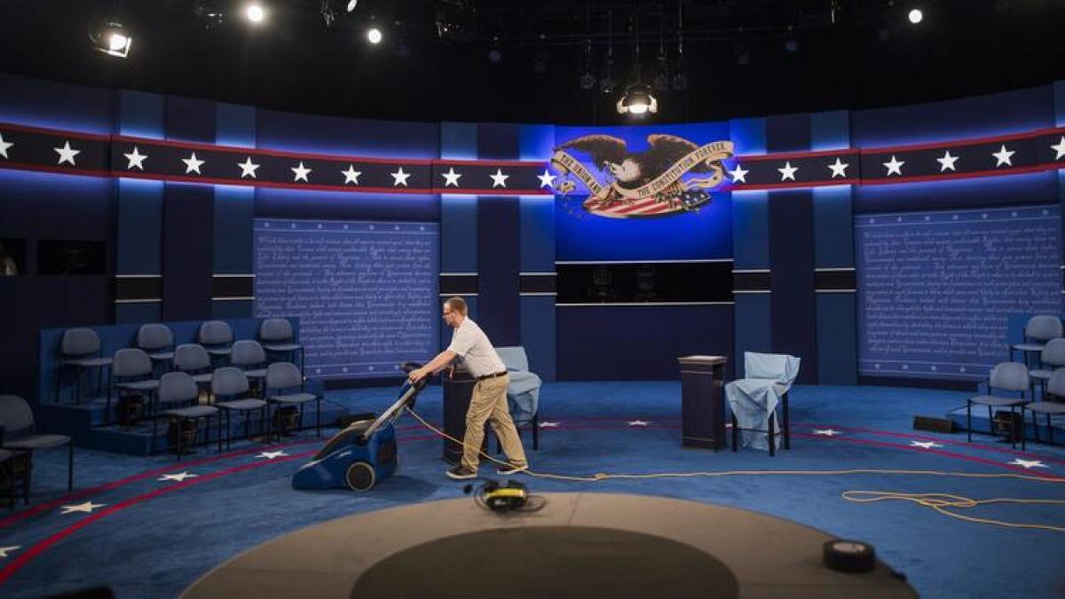Workers put the finishing touches on the debate stage at Washington University in Saint Louis.