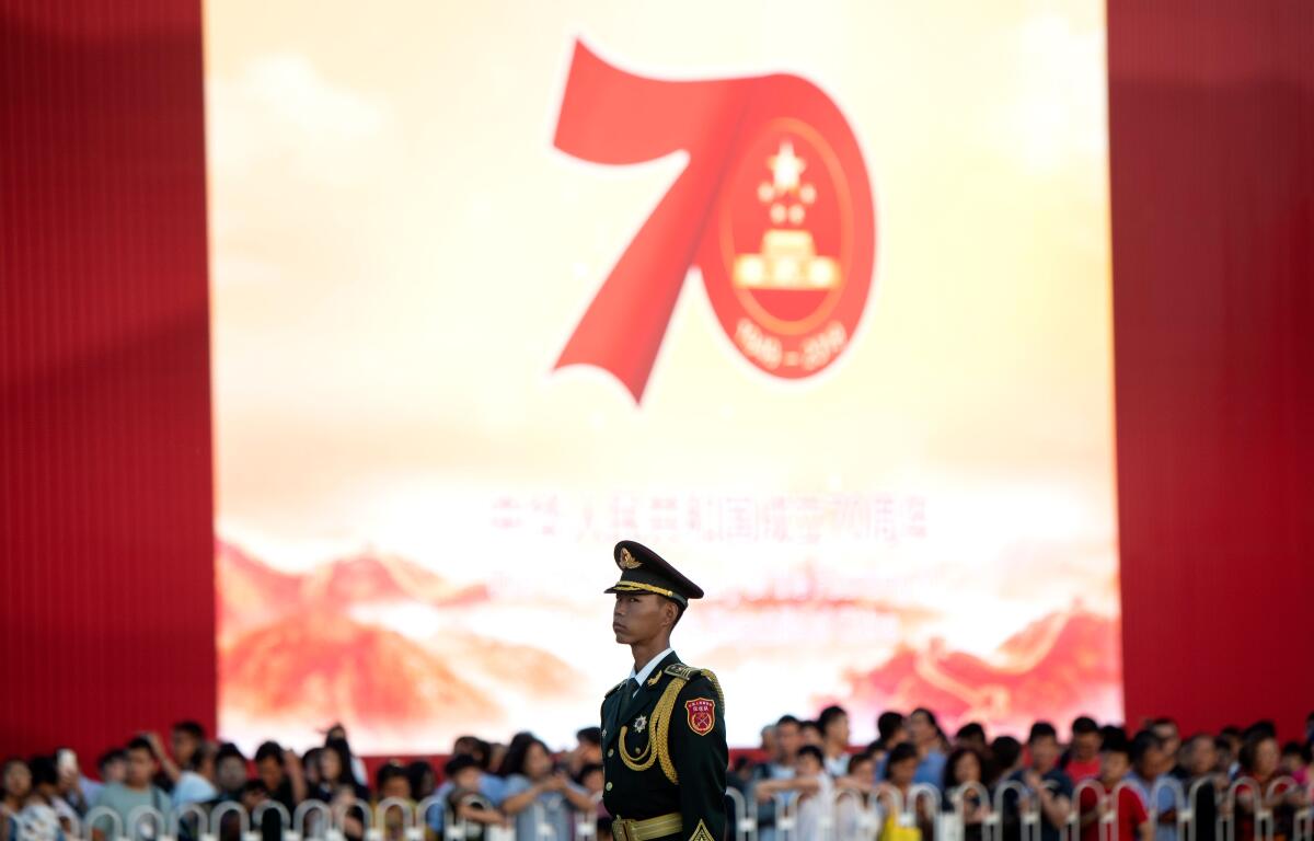 A Chinese paramilitary policeman stands in formation near Tiananmen, the Gate of Heavenly Peace, in Beijing on Sept. 27, 2019, four days before the 70th anniversary of the founding of the People's Republic of China.