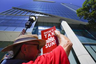 Bill Powers from University Heights was among the 75 demonstrators in front of the Sempra Energy office building. 