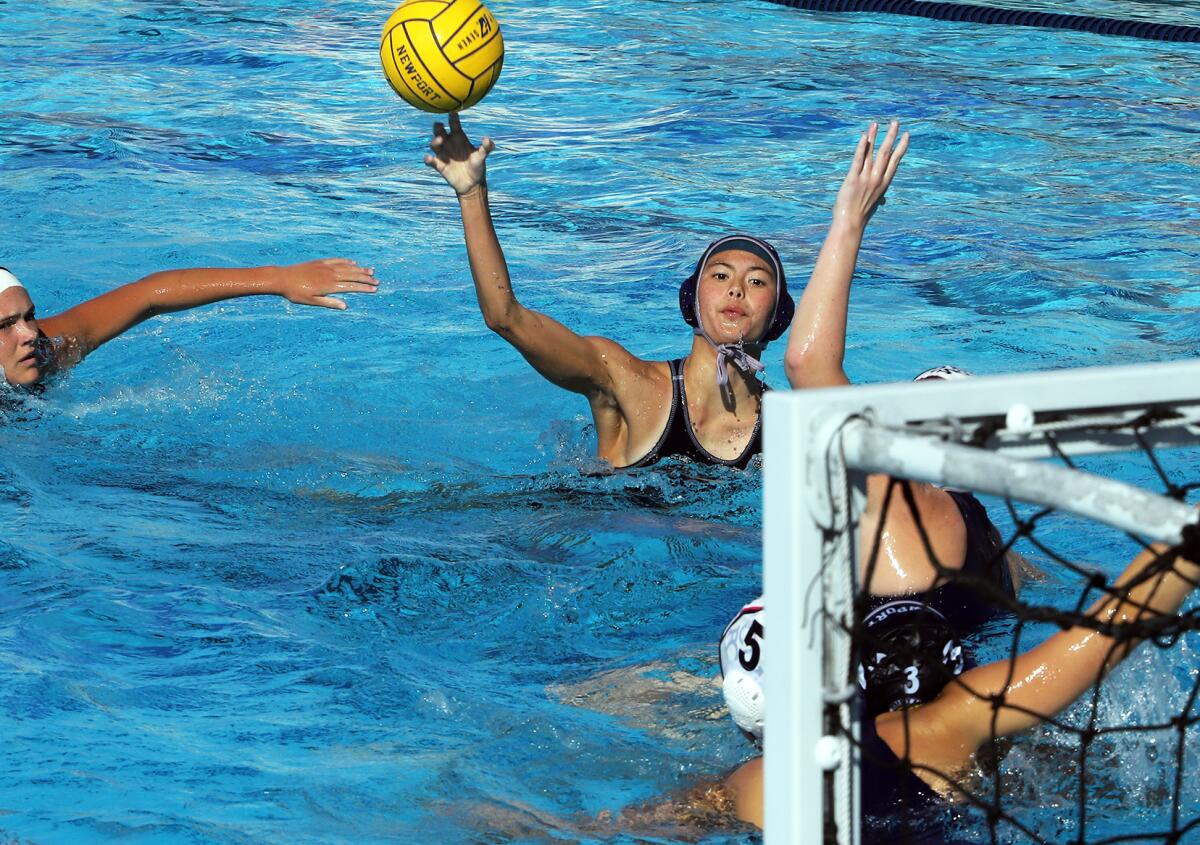 Newport Harbor's Caitlin Stayt (10) tries to lob over CdM's defenders to the goal during Saturday's match.