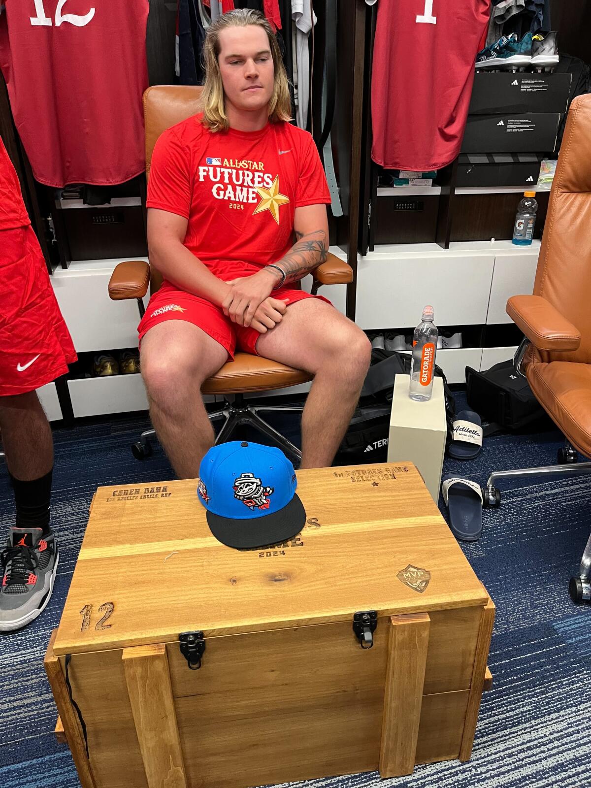 Angels prospect Caden Dana sits in the locker room before the MLB All-Star Futures Game at Globe Life Field.