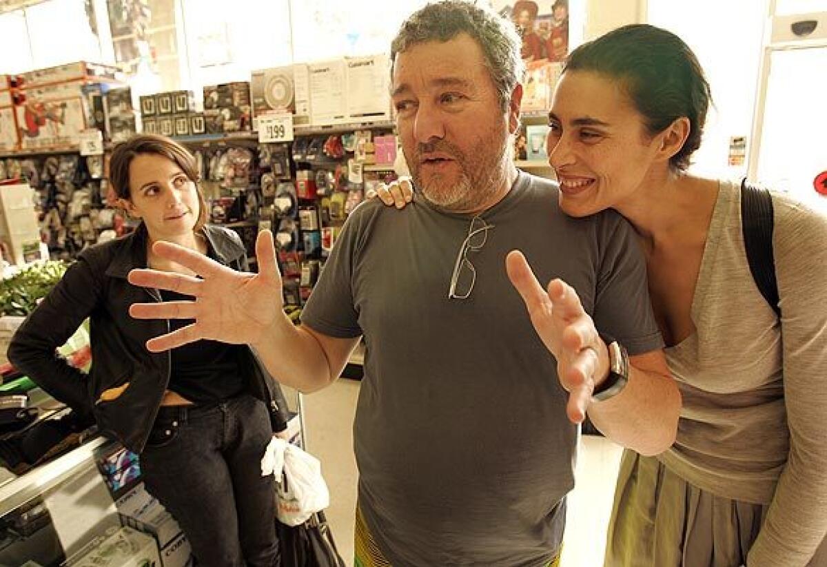 Famed designer Philippe Starck, his wife, Jasmine, right, and daughter Ara go shopping at a Big Lots store in Hollywood to show how far a dollar can go in recessionary times. In a time of financial crisis, we must go back to timeless objects and rediscover the elegance of basics, says Starck, the designer behind L.A. hot spots such as the restaurant Katsuya. Can you live elegantly and economically? We shall see. Give me 20 minutes, says the designer of furniture, accessories and other products.