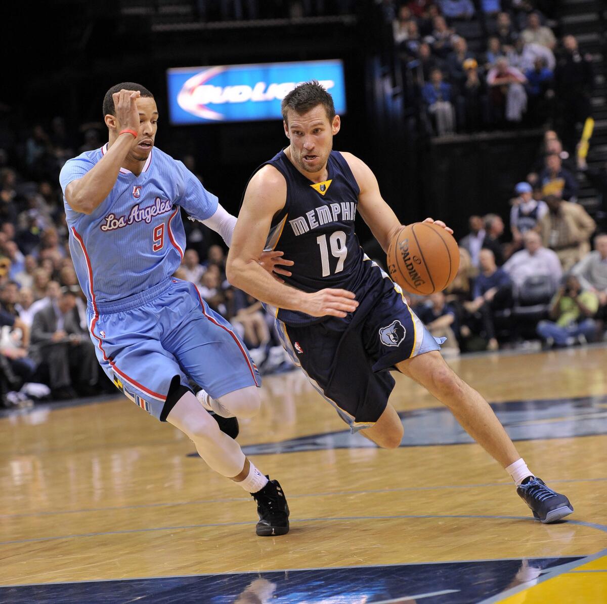 Memphis guard Beno Udrih drives past Clippers guard Jared Cunningham during a game on Nov. 23. The Clippers on Wednesday traded Cunningham to the Philadelphia 76ers.