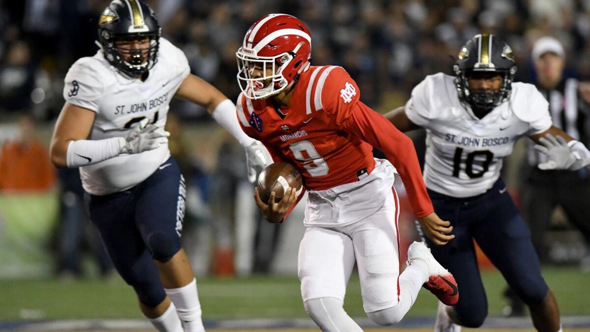 Mater Dei quarterback Bryce Young scrambles away from pressure by St. John Bosco defenders during the first half of their game Oct. 13.
