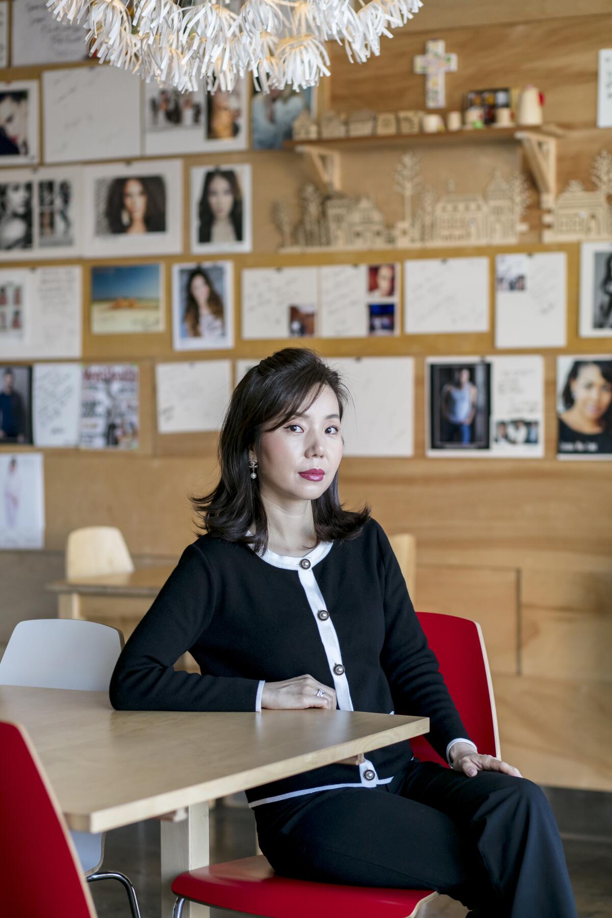 Chef Yoonjin Hwang, of Spoon by H, sits on a stool in her now-closed cafe.