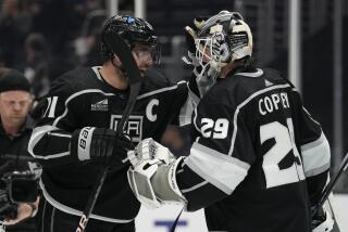 Los Angeles Kings center Anze Kopitar (11) and goaltender Pheonix Copley (29) celebrate after a 6-3 win over the Arizona Coyotes in an NHL hockey game Tuesday, Oct. 24, 2023, in Los Angeles. (AP Photo/Ashley Landis)