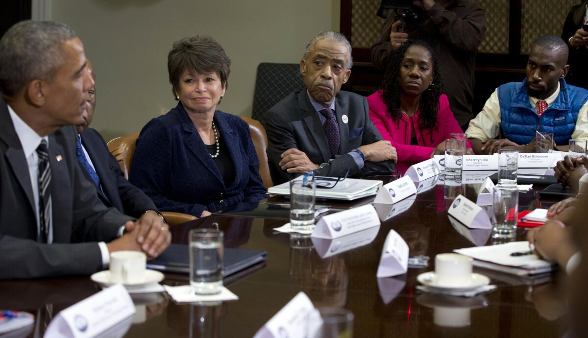 #BlackLivesMatter activist Deray McKesson, right, in the blue vest, meets with President Barack Obama and prominent civil rights leaders in the Roosevelt Room of the White House on Feb. 18.