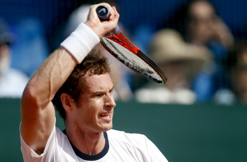 Andy Murray returns a shot against Ivan Dodig during Davis Cup play on Sunday.