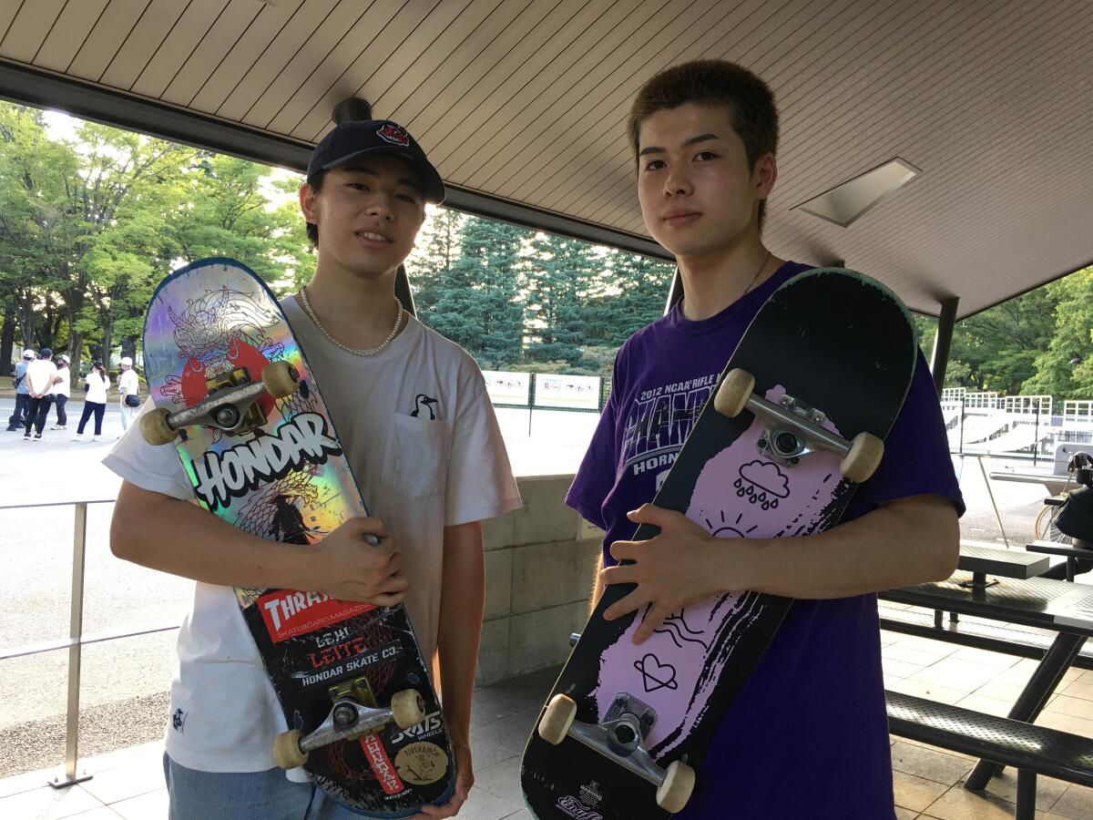 Friends Yuta Izumira, left, and Koshiro Hamada, right, both 18, near a closed skate park in Tokyo.