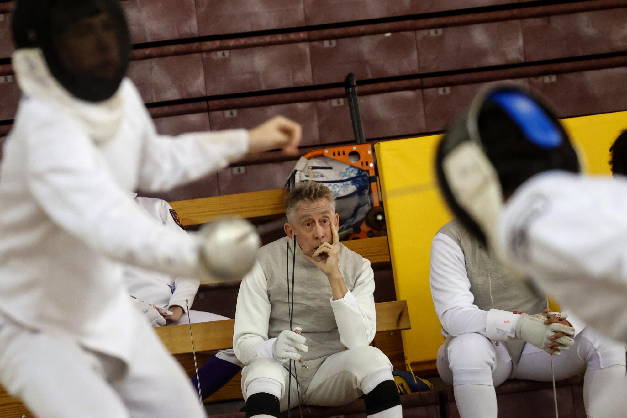 David Wharton watches as he waits to compete in the senior foil event.