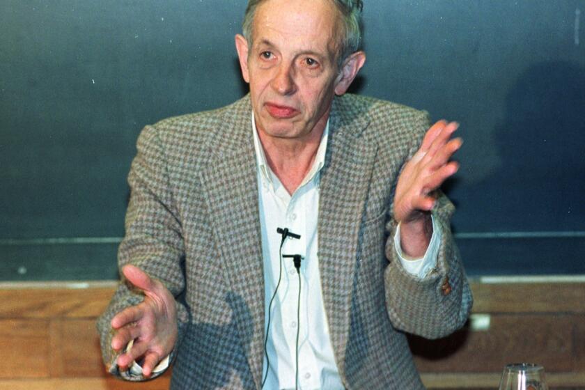 Princeton University professor John Nash speaks during a news conference after being named the winner of the Nobel Peace Prize for economics in 1994.