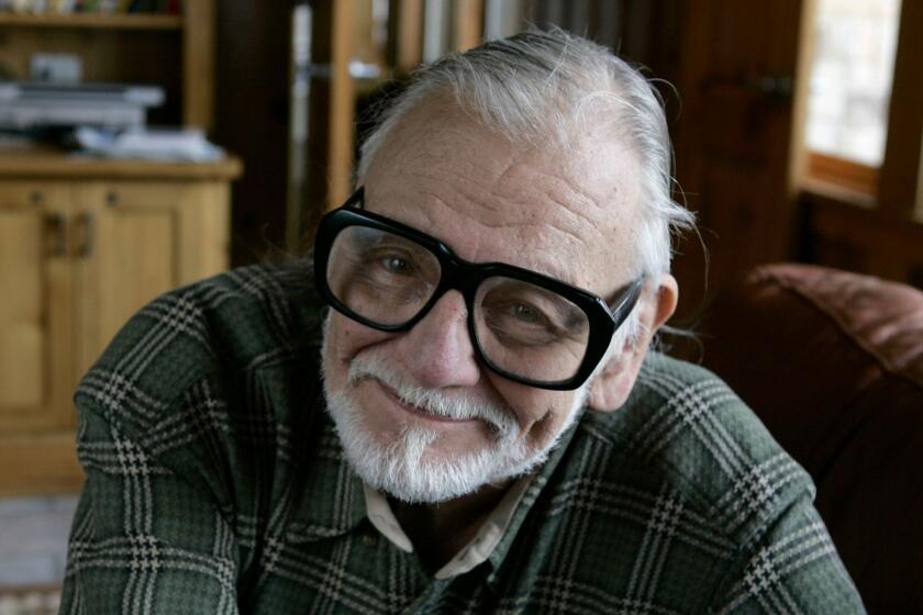 FILE - In this Monday, Jan. 21, 2008 file photo, director and writer George Romero poses for a photograph while talking about his film "Diary of the Dead' at the Sundance Film Festival in Park City, Utah. George Romero, whose classic "Night of the Living Dead" and other horror films turned zombie movies into social commentaries and who saw his flesh-devouring undead spawn countless imitators, remakes and homages, has died. He was 77. Romero died Sunday, July 16, 2017 following a battle with lung cancer. (AP Photo/Amy Sancetta, File)