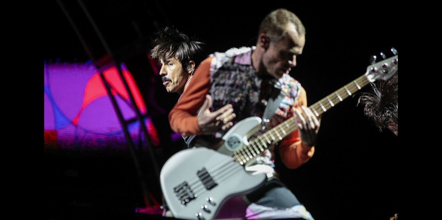 Red Hot Chili Peppers lead singer Anthony Kiedis, left, and bass player Flea perform during KAABOO.