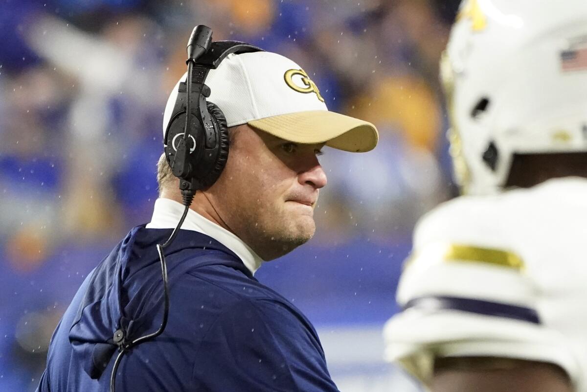 Georgia Tech interim head coach Brent Key talks to the team along the sideline during the first half of an NCAA college football game against Pittsburgh, Saturday, Oct. 1, 2022, in Pittsburgh. (AP Photo/Keith Srakocic)