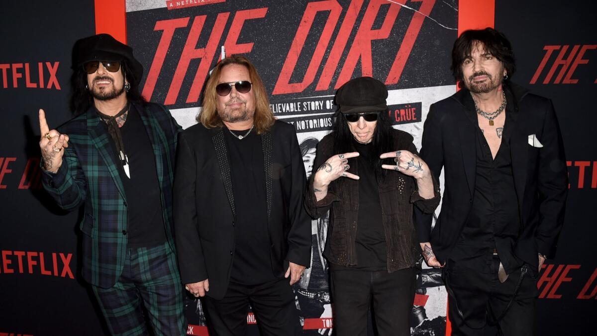 From left to right, Motley Crue members Nikki Sixx, Vince Neil, Mick Mars and Tommy Lee of Motley Crue arrive at the premiere of Netflix's "The Dirt" on March 18, 2019 in Hollywood, California.