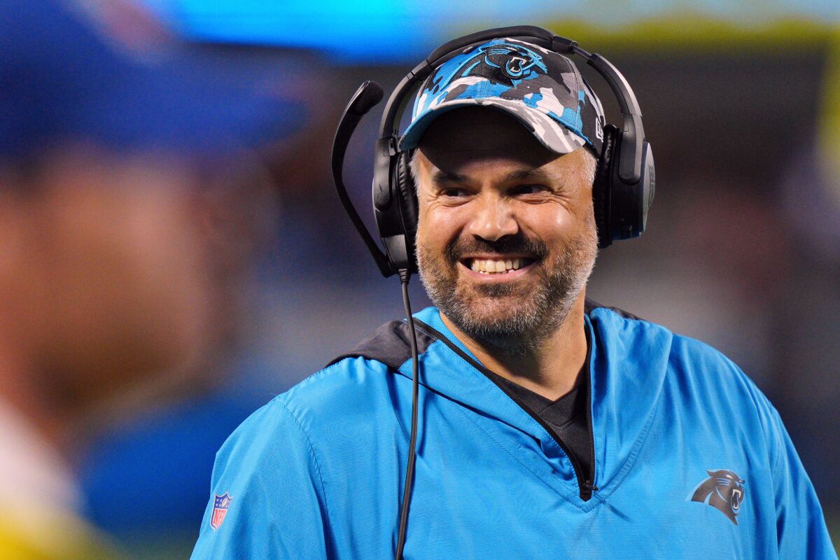 FILE - Carolina Panthers head coach Matt Rhule smiles during the first half of an NFL preseason football game against the Buffalo Bills on Friday, Aug. 26, 2022, in Charlotte, N.C. After six straight losing seasons and more than 20 years removed from its 1990s heyday, Nebraska is turning to Matt Rhule to rebuild its football program and make it competitive in the Big Ten Conference. (AP Photo/Jacob Kupferman, File)