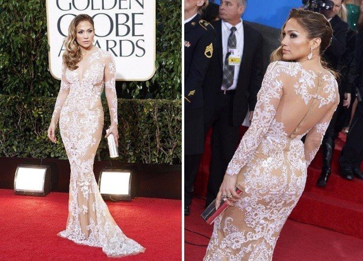 Jennifer Lopez, in a body-baring, long-sleeved cream lace Zuhair Murad gown, gave us the fashion moment we'd been waiting for, and one to rival the famously low-cut leafy Versace gown she wore to the Grammys in 2000.
