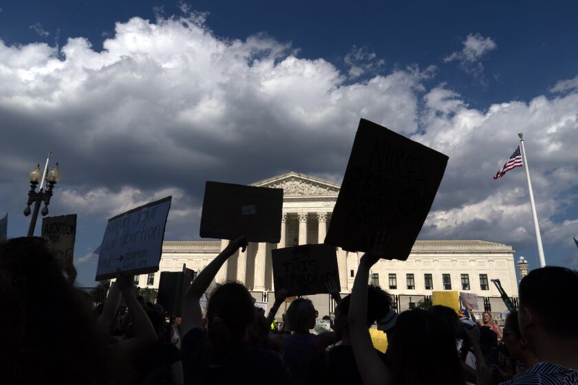 FILE - Abortion-rights activists protest outside the Supreme Court in Washington, Saturday, June 25, 2022. An Associated Press-NORC Center poll found that most U.S. adults favor allowing abortion at least in the early weeks of pregnancy. (AP Photo/Jose Luis Magana, File)