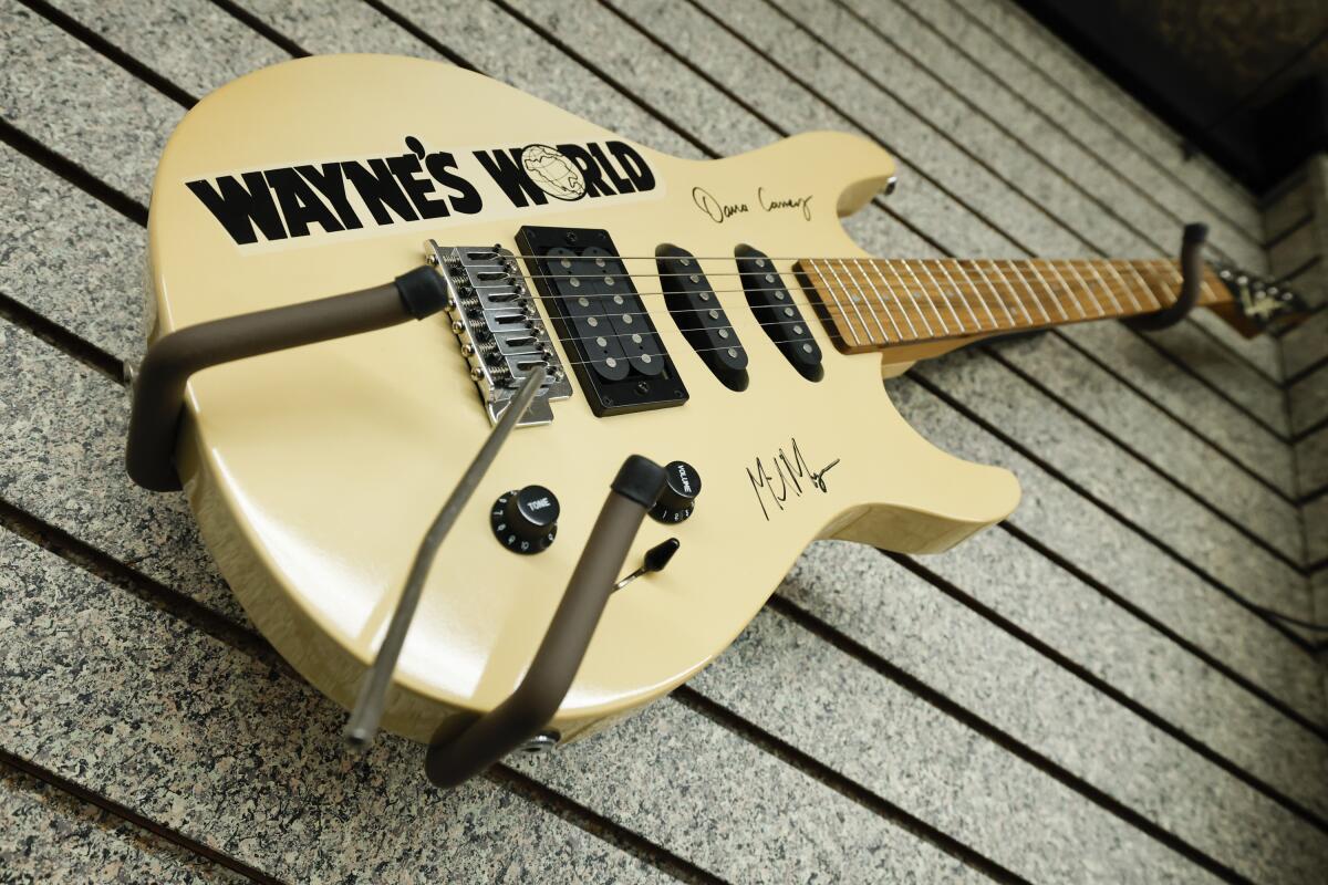 A "Wayne's World" guitar signed by Mike Myers and Dana Carvey is displayed at Cassell's Music.