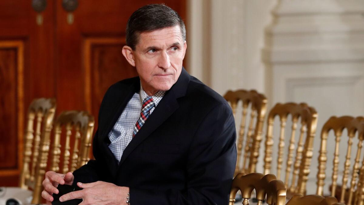 Retired Gen. Michael Flynn sits in the front row before the start of President Donald Trump and Japanese Prime Minister Shinzo Abe’s joint news conference in the White House on Feb. 10.