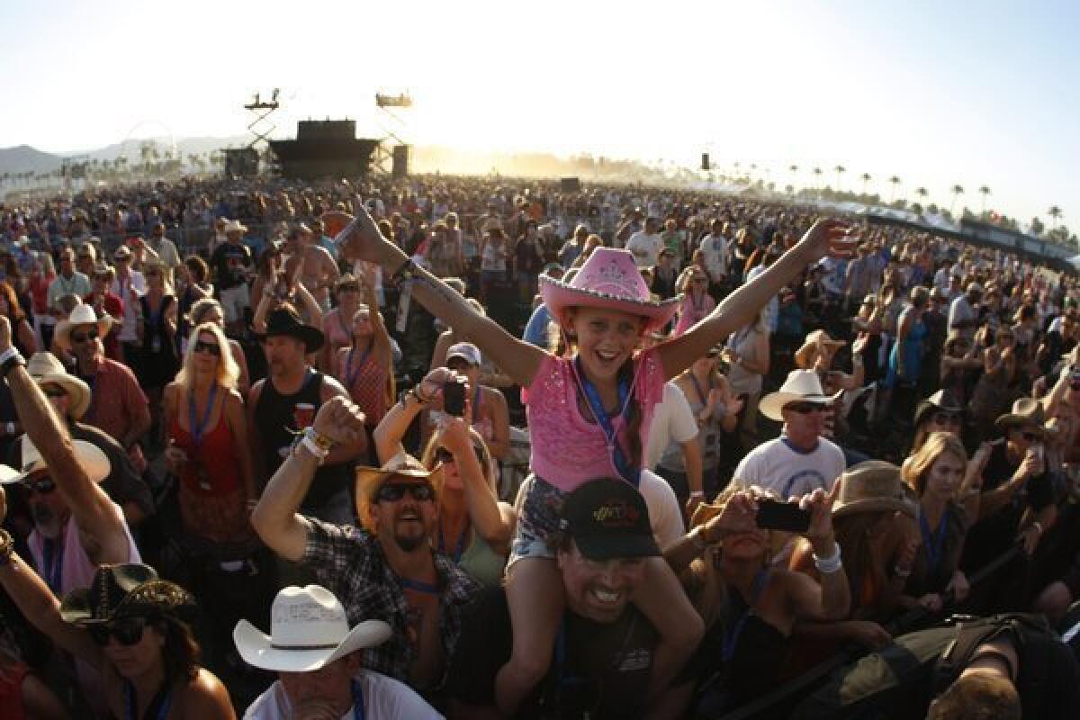 A young fan celebrates at Stagecoach in 2012.