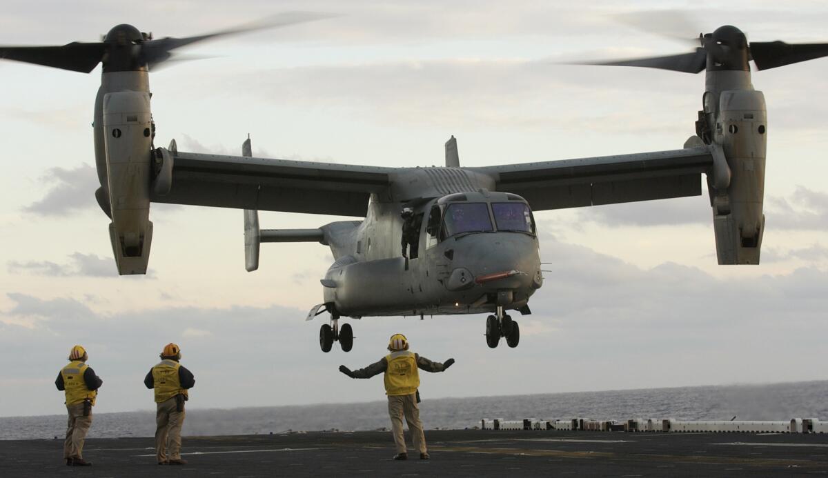 A V-22 Osprey takes off from the deck of the aircraft carrier Iwo Jima off North Carolina in 2003.