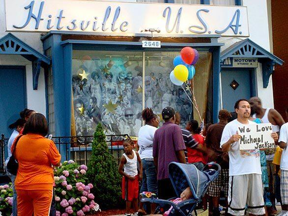 Fans gather at a makeshift memorial outside of the Motown Museum, Hitsville USA, in Detroit.