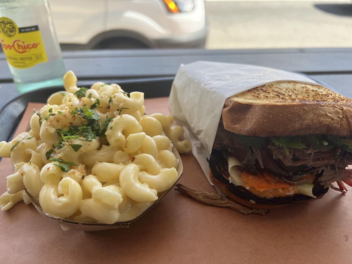 Mac & Cheese and brisket sandwich on potato bread from Heritage BBQ in San Juan Capistrano.