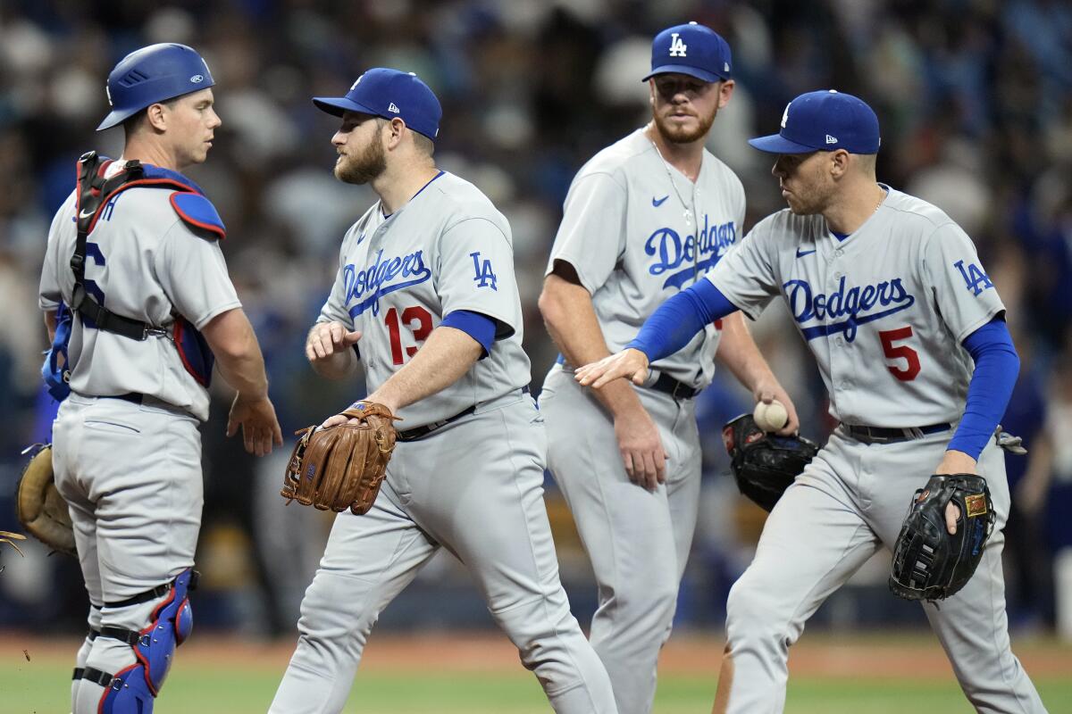 From left, Dodgers catcher Will Smith, third baseman Max Muncy, reliever Caleb Ferguson and first baseman Freddie Freeman.