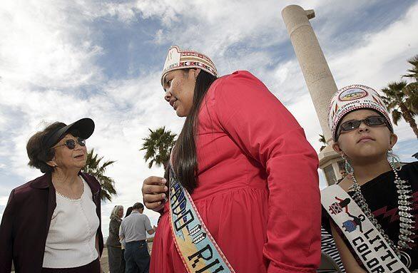 Former Poston internee Maria Uyeda, left, meets Talyia Carter, Miss Colorado River Tribes, center, and Lauryn Miller, Little Miss Colorado River Tribes, after a ceremony at the Poston Monument Memorial near Parker, Ariz. More than 17,000 people of Japanese ancestry were held at the Poston internment camp, also known as the Colorado River War Relocation Center, during World War II.