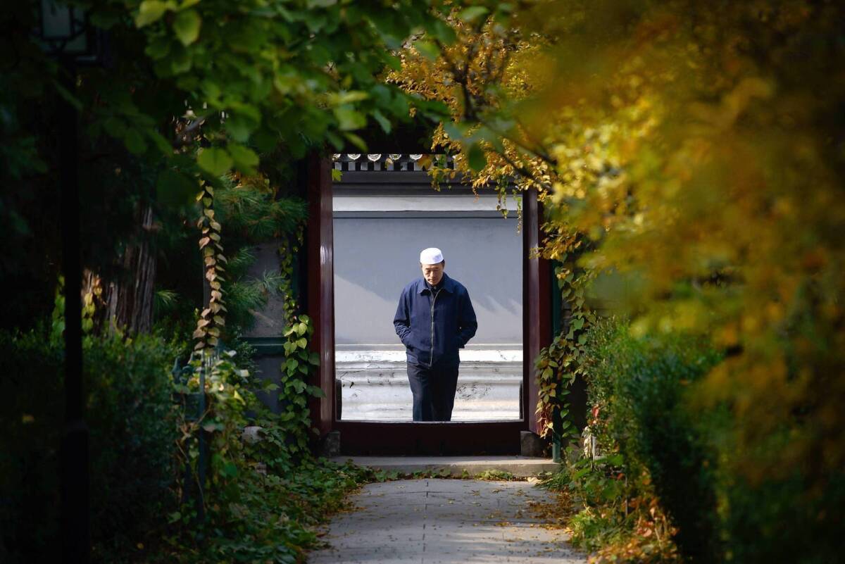 An ethnic Uighur arrives at a mosque in Beijing. Uighurs in the capital are fearful of losing their jobs or apartments because of the Tiananmen Square attack.