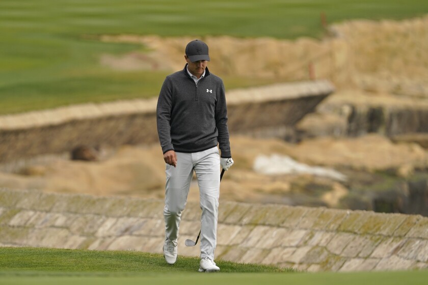 Jordan Spieth walks up to the 18th green of the Pebble Beach Golf Links during the final round of the AT&T Pebble Beach Pro-Am golf tournament Sunday, Feb. 14, 2021, in Pebble Beach, Calif. (AP Photo/Eric Risberg)